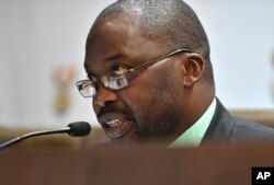 South Africa's minister of justice and correctional services, Michael Masutha, speaks to the press in Pretoria, South Africa, Oct. 21, 2016.