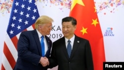 Дональд Трамп и Си Цзиньпин во время саммита лидеров G20 в Осаке, Япония, 29 июня 2019 года