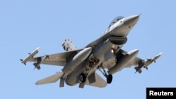 FILE - A Turkish F-16 fighter jet approaches the tarmac of Incirlik airbase in the southern Turkish city of Adana, July 4, 2012.
