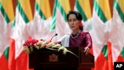 Myanmar's State Counsellor and de facto leader Aung San Suu Kyi delivers a televised speech to the nation at the Myanmar International Convention Center in Naypyitaw, Sept. 19, 2017.