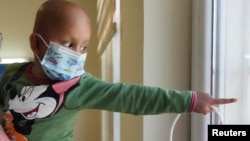 Sabreen Abdel Zahra Hussein, 26 years old, cancer survivor who works as a volunteer at the same hospital where she received her treatment as a child