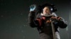 Axiom Space chief engineer Jim Stein demonstrates a prototype spacesuit, March 15, 2023, in Houston. 