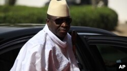 FILE- Gambia President Yahya Jammeh arrives for a summit in Abuja, Nigeria, Feb. 27, 2015. The president fired three government ministers in a department reshuffle.