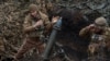 Українські військовослужбовці 28-ї окремої механізованої бригади поблизу Бахмута, 15 березня 2024. REUTERS/Oleksandr Ratushniak