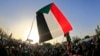 Sudanese demonstrators gather during a rally outside the army complex in the capital Khartoum, April 16, 2019. 