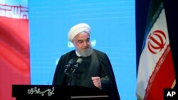 In this photo released by the official website of the Office of the Iranian Presidency, President Hassan Rouhani speaks in a meeting in Tehran, Iran, Dec. 4, 2019. 