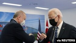 Turkish President Tayyip Erdogan meets with U.S. President Joe Biden on the sidelines of the NATO summit in Brussels, Belgium, June 14, 2021. (Murat Cetinmuhurdar/Presidential Press Office/Handout via Reuters) 
