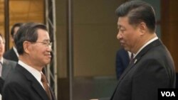 中国国家主席习近平在博鳌与前台湾副总统萧万长见面
