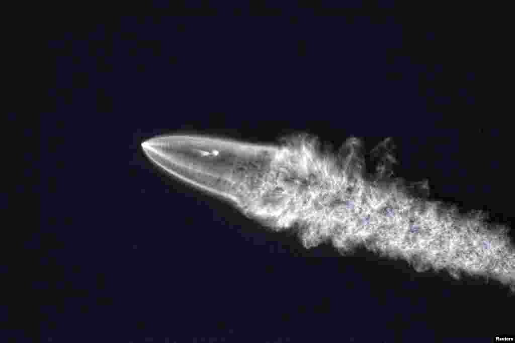 SpaceX's Falcon 9 rocket lifts off in the air, as seen from Santa Monica, California, in this Dec. 22, 2017 picture obtained from social media.