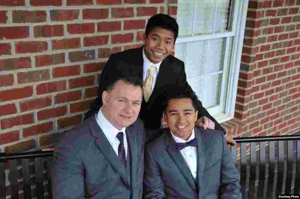 Jordan Pisey Windle, a five-time national champion diver, posed for a picture with his two-male parents, Jerry Windle and Andres Rodriguez. (Courtesy Photo)