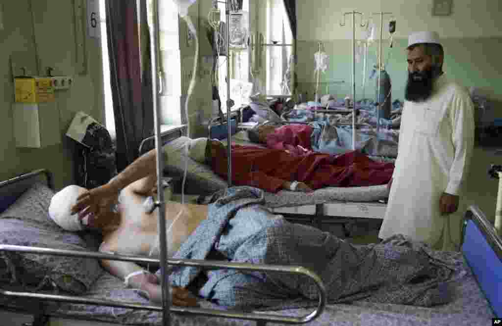 Wounded men lie on their beds in Wazir Akbar Khan Hospital in Kabul, Afghanistan, May 31, 2017.