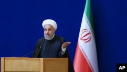 Le président iranien Hassan Rouhani s'exprime lors d'une cérémonie marquant la journée nationale de l'énergie nucléaire du pays, à Téhéran (Iran), le 7 avril 2016. Iranian Presidency Office via AP)