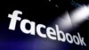 FILE - FILE - In this March 29, 2018 photo, the logo for Facebook appears on screens in New York's Times Square.