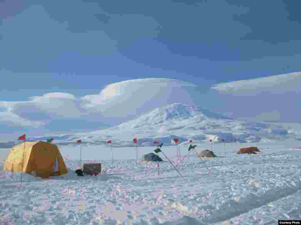 Base camp on the McMurdo Ice Shelf floats on a 200-meter- thick ice shelf, which in turn floats on the ocean which is one kilometer deep at that point. (David Holland)