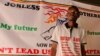 Norman Tumuhimbise and says he and Robert Mayanja brought piglets into parliament to protest political corruption and greed, Kampala. July 9, 2014. (Hilary Heuler/VOA)