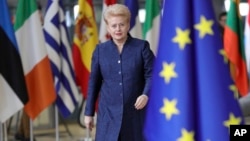 FILE - Lithuanian President Dalia Grybauskaite arrives for an EU summit at the Europa building in Brussels, Dec. 14, 2017.