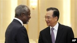 Former U.N. Secretary General Kofi Annan, left, is greeted by Chinese Premier Wen Jiabao during their meeting at the Great Hall of People in Beijing, March 27, 2012.