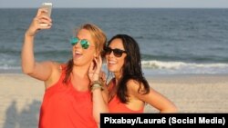 FILE - American teenagers are using YouTube, Instagram and Snapchat more, and Facebook less, according to Pew Research Center.
