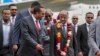 Eritrea’s foreign minister, Osman Saleh Mohammed, center right, is welcomed by Ethiopia’s prime minister, Abiy Ahmed, center left, upon the Eritrean delegation’s arrival at the airport in Addis Ababa, Ethiopia, June 26, 2018. 
