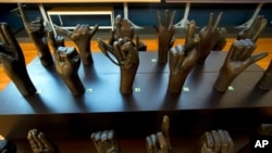 FILE - A sculpture of hands signing the alphabet is seen at Gallaudet University museum in Washington, Dec. 11, 2019.