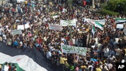 Demonstrators protest against Syria's President Bashar al-Assad in Hula, near Homs, October 27, 2011.