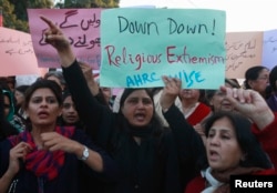 FILE - Women chant slogans condemning Islamist terrorism during an anti-terror rally in Lahore, Pakistan, Jan. 16, 2015.