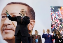 Turkey's President Recep Tayyip Erdogan gestures as he speaks during a rally of his ruling Justice and Development Party's supporters, in Mersin, southern Turkey, March 10, 2018. Erdogan has criticized NATO for not supporting the country's military operation against the Syrian Kurdish People's Protection Units or YPG, that started January 20 to clear them from Afrin in northwestern Syria. Erdogan asked, "Hey, NATO, where are you?"