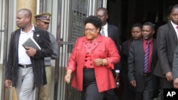 FILE: Mrs. Joice Mujuru leaving a court in Harare where an inquest was being held to investigate the death of her husband, Retired General Solomon Mujuru, who mysteriously died in an inferno.