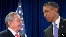 FILE - Though Cuba says it will welcome U.S. President Barack Obama next week, its leadership editorialized in Communist Party media that the U.S. government should stop meddling in the island’s internal affairs. Obama and Cuban President Raul Castro, left, spoke before a U.N. meeting in New York, Sept. 29, 2015.