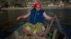 Chrifa Nimri arranges a net after returning from fishing at the seaport Sidi Bou Said, in Tunis.