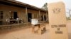 FILE - A sign for Ghana's Electoral Commission is seen at a voting station in Accra during a previous poll.