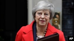 Britain's Prime Minister Theresa May leaves Downing Street in London, Dec. 4, 2018. 