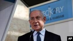 FILE - Israeli Prime Minister Benjamin Netanyahu speaks at Ben-Gurion International Airport, near Tel Aviv, Nov. 9, 2020.