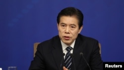 中國商務部部長鐘山2018年3月11日出席記者會。