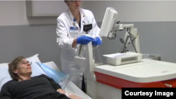 Stacy Erholtz receives a test to confirm she's in remission from myeloma after receiving a novel virotherapy in this screenshot from a Mayo Clinic video.