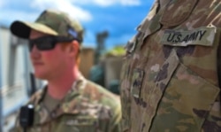 FILE - U.S. soldiers are seen during a hand-over ceremony in the northern Iraqi province of Nineveh, March 30, 2020.