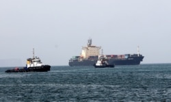 FILE - Ships are seen in the Gulf of Oman, Feb. 25, 2019.