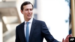 FILE - White House Adviser Jared Kushner waves as he arrives at the Office of the United States Trade Representative in Washington, Aug. 29, 2018.