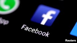 FILE: The Facebook application is seen on a phone screen, Aug. 3, 2017. 
