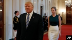 President Donald Trump, followed by his daughter Ivanka Trump, walks to the East Room of the White House in Washington, Tuesday, Aug. 1, 2017, to speak with small business owners as part of "American Dream Week."