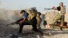 Les forces irakiennes reprennent des zones autour de Ramadi