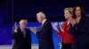 FILE - Eight 2020 Democratic presidential candidates are seen in a combination from file photos.