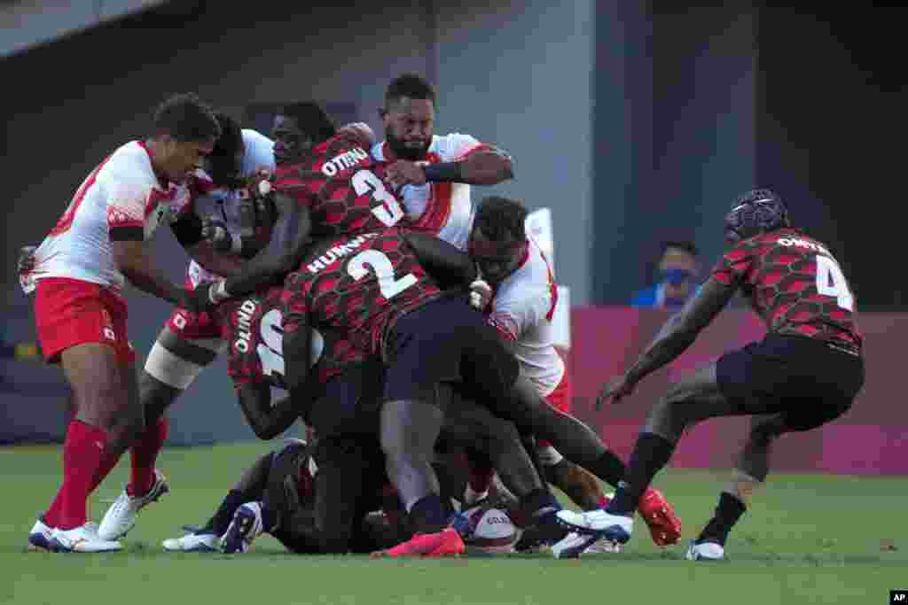 Japan and Kenya players vie for the ball in their men's rugby sevens match at the 2020 Summer Olympics, Tuesday, July 27, 2021 in Tokyo, Japan. (AP Photo/Shuji Kajiyama)