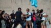 Miles en España protestan contra ley que exige uso de mascarillas