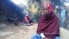 Rohingya Muslim refugee Mohammad Eliyas, with his wife and children, at his Cox's Bazar shanty colony in Bangladesh. With his wife and two children Eliyas fled Myanmar after Burmese soldiers burnt his house, Nov. 2016. (S. Islam for VOA)