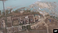 FILE - satellite image provided by GeoEye shows the area around the Yongbyon nuclear facility in Yongbyon, North Korea. The U.S.-Korea Institute at Johns Hopkins School of Advanced International Studies said shows that North Korea has resumed building wor