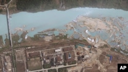 FILE - satellite image provided by GeoEye shows the area around the Yongbyon nuclear facility in Yongbyon, North Korea.