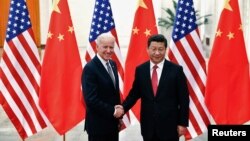 2013年12月4日中国国家主席习近平在北京人民大会堂会见美国副总统拜登。