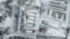 This handout satellite image released by Maxar Technologies shows a close up of armored personnel carriers and trucks at Russia's Klimovo storage facility, in Bryansk Oblast, 13 kilometers north of the Russia/Ukraine border, Jan. 19, 2022.