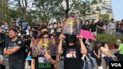 Hong Kong protesters rally in Tsim Sha Tsui against police brutality on Sunday, October 27.